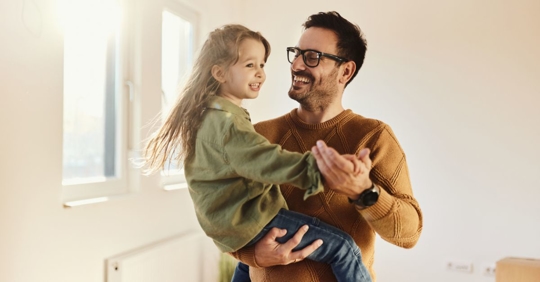 Dad and daughter dancing